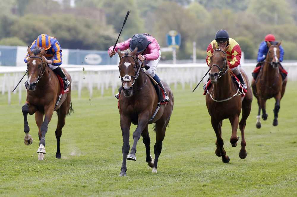 Spanish Mission and William Buick (centre) win the Yorkshire Cup from Santiago (left)