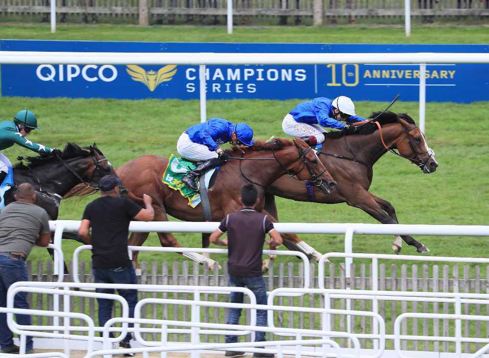 Live Your Dream (white cap) winning at Newmarket in July