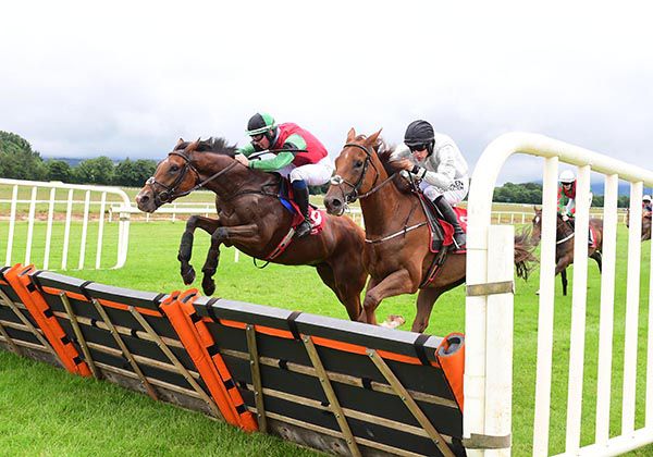 Winner Ilmig (Donagh Meyler) jumps just ahead of Carrarea (Brian Hayes)