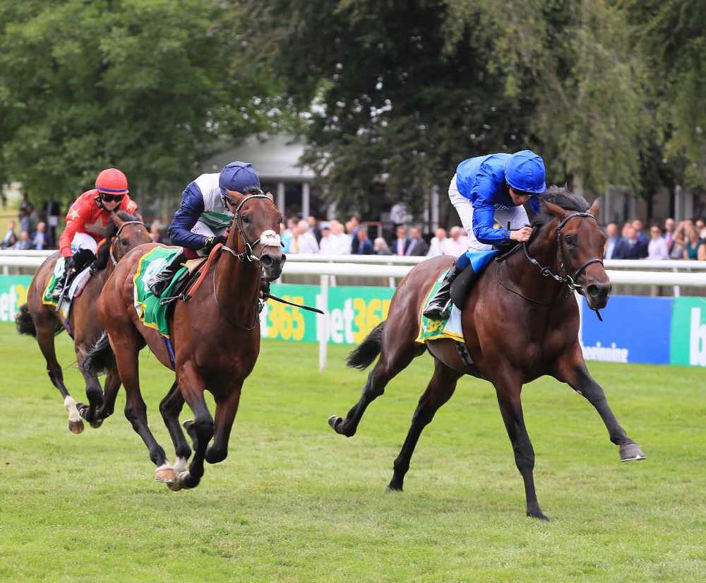 Masekela (centre) is narrowly defeated by Native Trail on the July Course