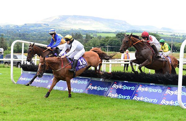 All Class and Sean Flanagan (red cap) jump the last en route to victory
