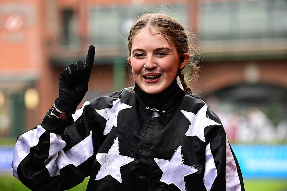 Julie McDonald celebrates winning on Miss Louise