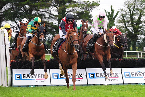 Saldier and Patrick Mullins (right) challenge at the last  