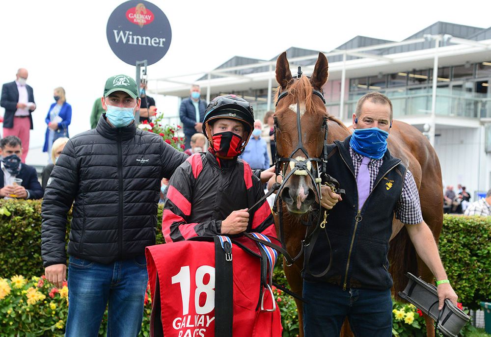 Crowns Major and Wesley Joyce with trainer Emmet Mullins, left, and groom Mick Molloy 