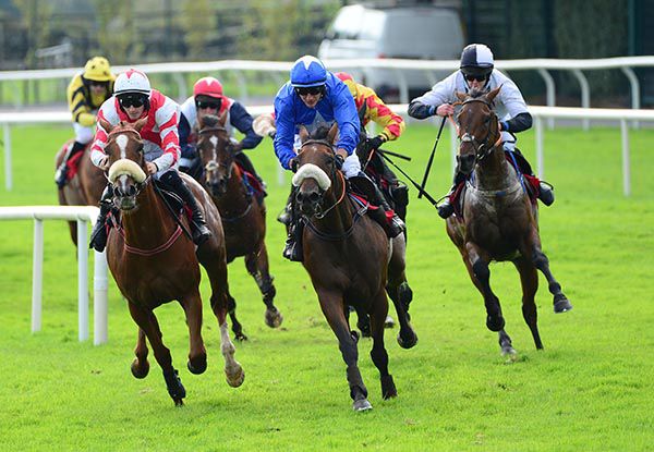 Son Of Hypnos and Shane Fitzgerald (right) chase the leaders on the home turn