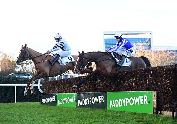 Grange Walk (left) and Exit Poll jumping the last