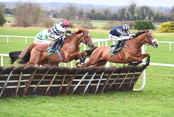 J J Slevin (red cap) comes with a winning run on Banbridge at the last
