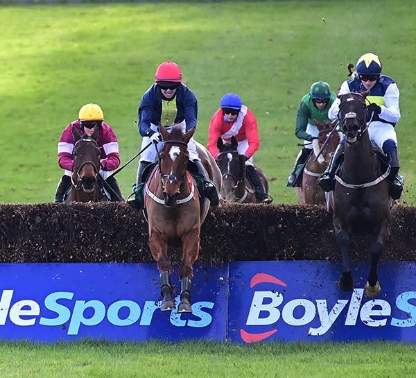 Longhouse Poet and Darragh O'Keeffe (left) jump the last to win from Franco De Port (right)