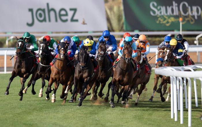 Authority (light blue/red armlets) leads into the straight at Riyadh