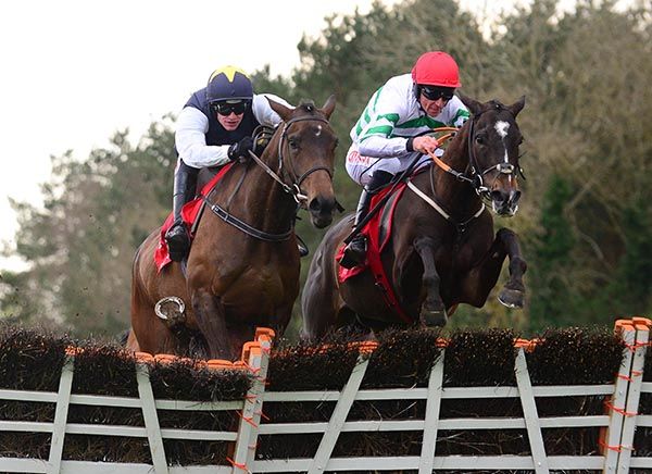 Party Central and Davy Russell (right) jump the last alongside Instit