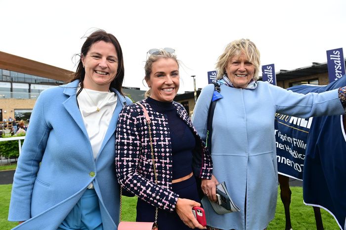 Kate Harrington, centre, with her sister Emma and mother Jessica
