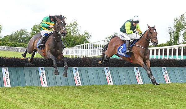 Ballybaun Star (right) jumps the last alongside Spick And Span