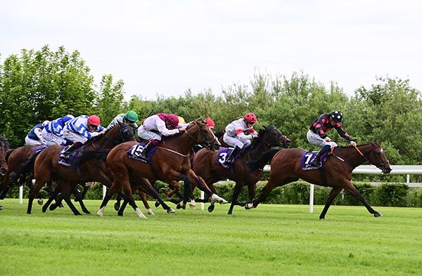 Big Dream leads in the closing stages with Focus Required (maroon and white) coming with his effort down the outer