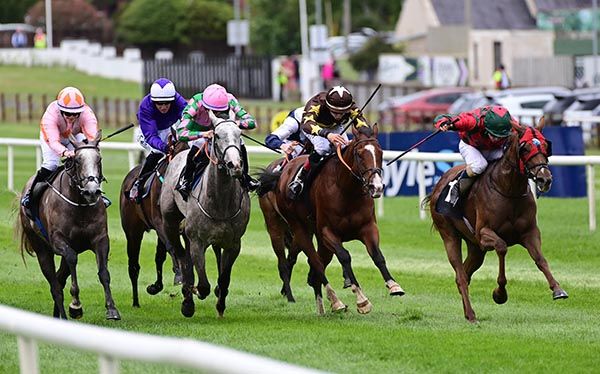 Tiny Bit (far right) comes through to lead under Declan McDonogh