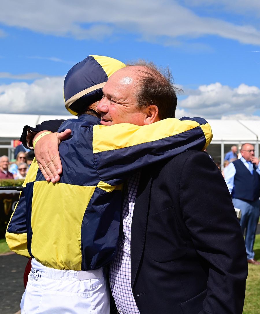 Michael Halford and Ronan Whelan embrace after Surrounding gained an emotional win at Galway