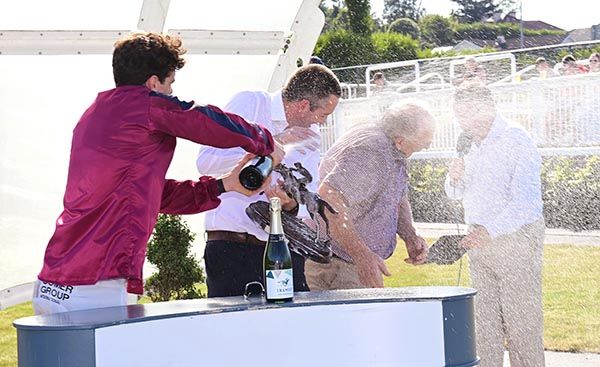 Danny Mullins gets the champagne flowing after Ferdia's win in the opener