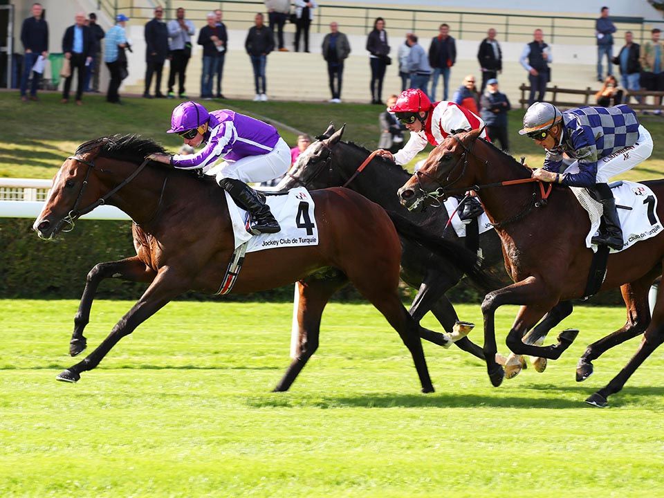 Continuous wins at Saint-Cloud under Ryan Moore with Syros (checks) second past the post for Christophe Soumillon 