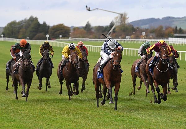 Downforce and Nathan Crosse (grey cap, centre)