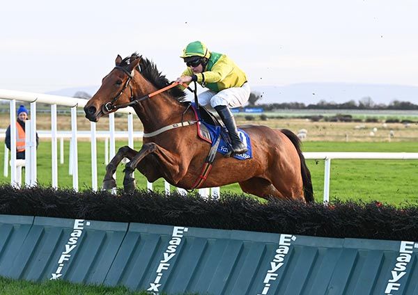 Carrig Carol and Brian Lawless jump the last