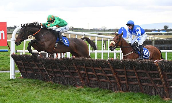 Whatsavailable jumps the last well on his way to victory