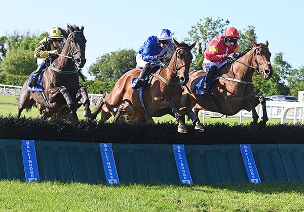 We'llhavewan (far right) jumps the last in a share of the lead