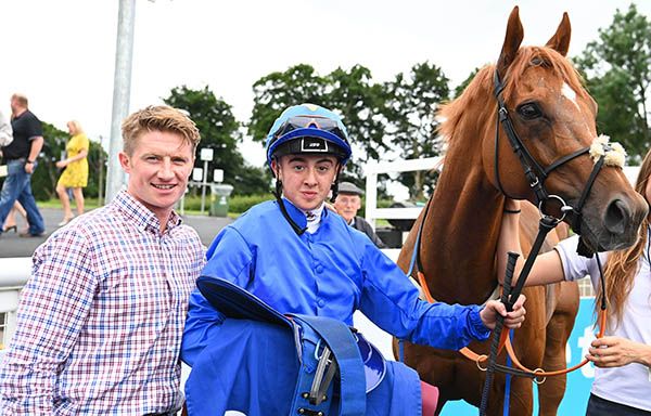 A first winner for jockey Kyle McHugh, seen with trainer Denis Hogan, on Big Baby Bull 