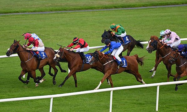Golden Days and Ronan Whelan red  black win the Coast To Curragh Cycle Handicap  