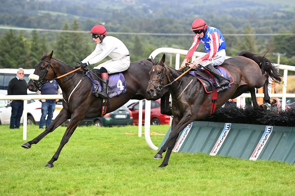 Glendars Mahler and Mark McDonagh far side clear the final hurdle with Air Drop 