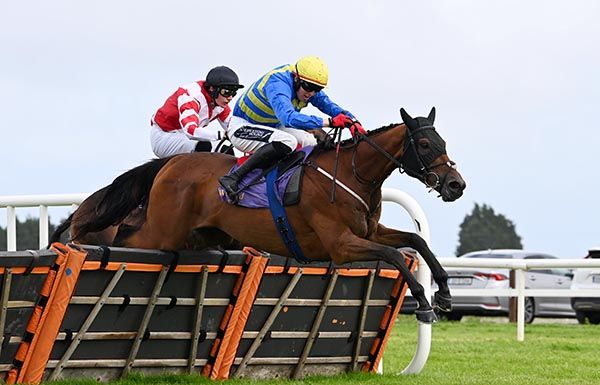 Dutch Schultz clears the last under Keith Donoghue