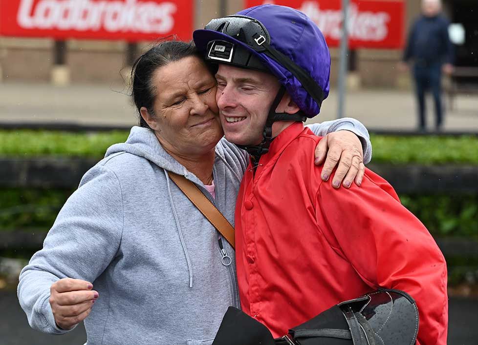 Wesley Joyce is hugged by mom Geraldine after his win aboard Final Check  