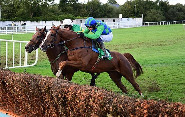 Power Of Pause and Paul Townend near side win the Brandon Hotel Beginners Steeplechase from Genois .