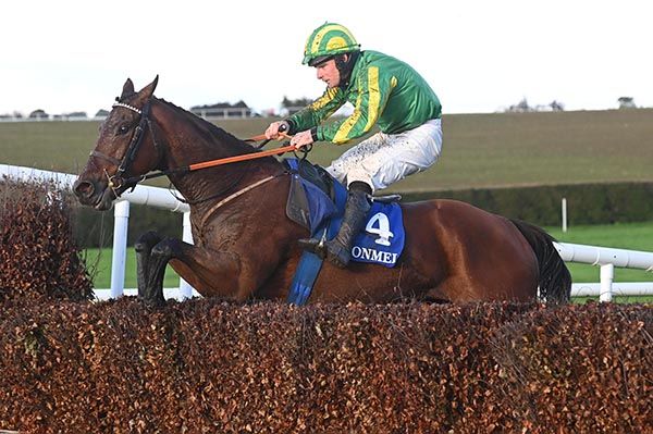 Bonnie Kellie and Pa King tackle the final fence