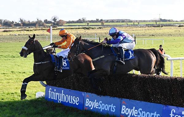 Faith Loving and Dillon Maxwell (near side) jump the last alongside Greenway Machine