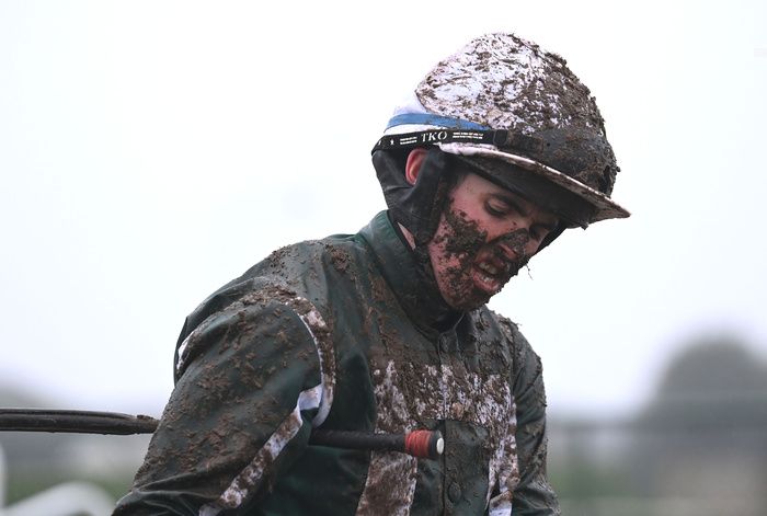 Tramore 1-January-2024.Jockey Darragh O'Keeffe bears the effects of the heavy ground.Healy Racing