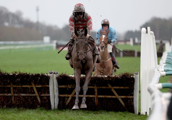 A mud-splattered Now Is The Hour and Sean Flanagan at Haydock