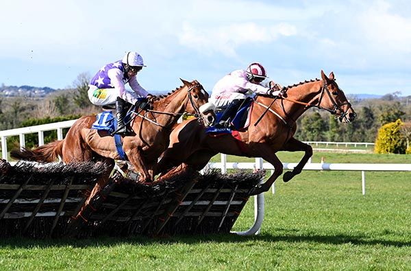 Instant Tendance (right) and Sam Ewing jumping the last