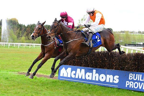 Favori De Champdou and Jack Kennedy (far side) jump the last alongside Donacheady Gale 