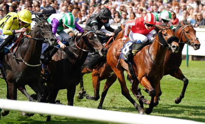 Seven Questions and Callum Shepherd red winning the William Hill Palace House stakes Newmarket