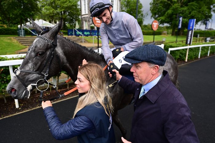 Fallen Angel with Danny Tudhope, trainer Karl Burke and groom Alice Kettlewell after her Irish 1000 Guineas