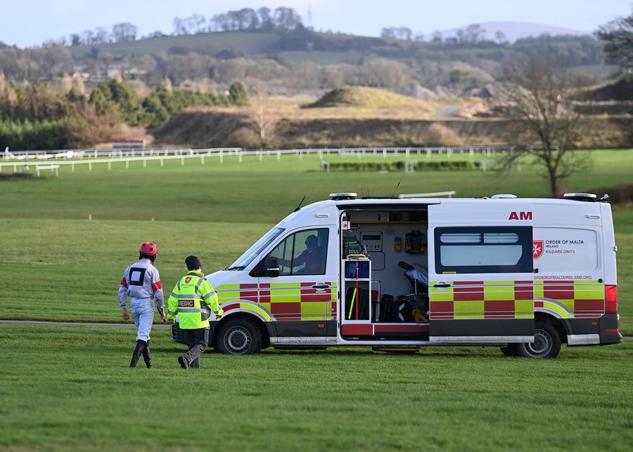 Punchestown 23-November-2024 Jockey Jordan Kidd walking to the ambulance after his fall.Healy Racing