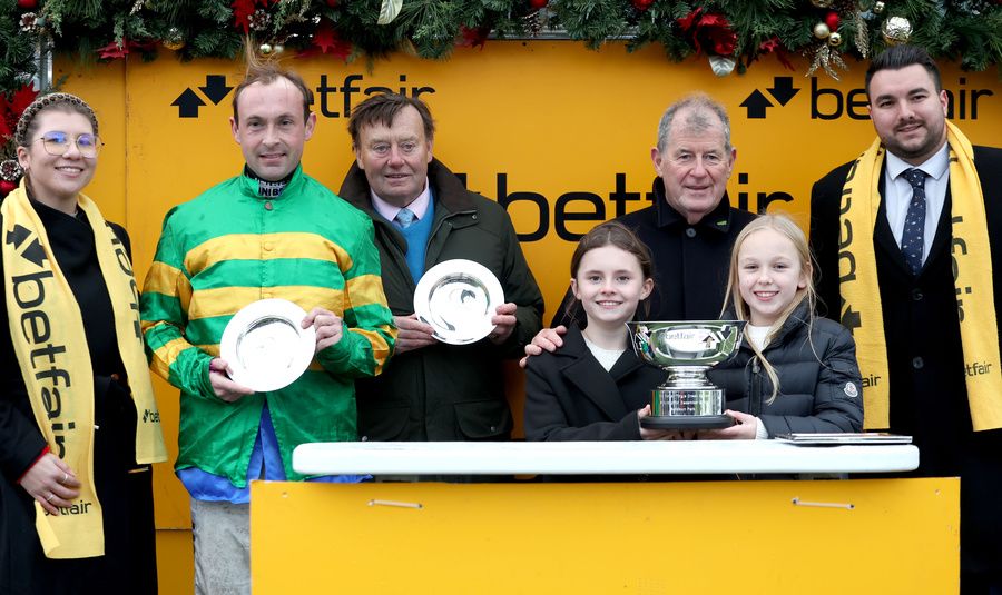 Jockey Nico de Boinville with Nicky Henderson (centre)