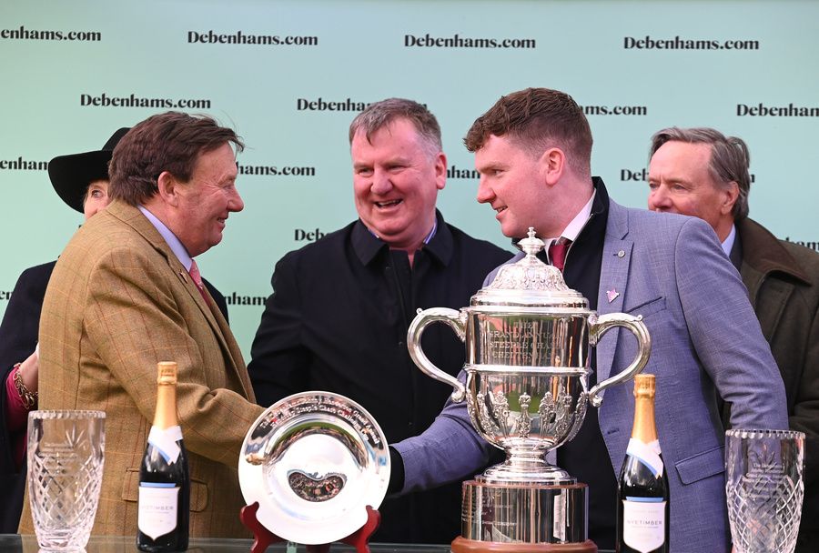 Trainer Cian Collins with dad Alan behind and Nicky Henderson after Jazzy Matty won 