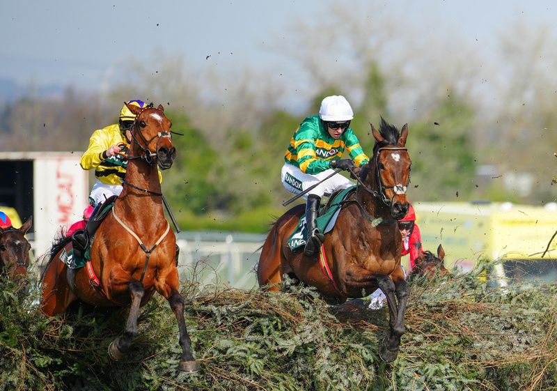 Aintree 4-April-2025Gentleman De Mee and Mark Walsh (white cap) clear the last fence alongside Amirite to win for trainer Willie Mullins.Healy Racing