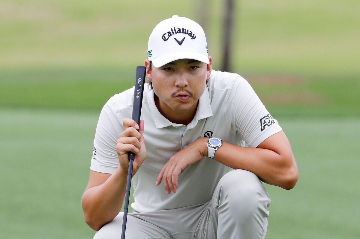 3A7W8K1 Min Woo Lee looks over the eighth green before putting in the first round of the Houston Open golf tournament, Thursday, March 27, 2025, in Houston. (AP Photo/Michael Wyke)
