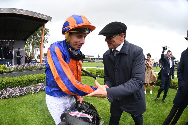 A happy Aidan O Brien greets Ryan Moore after Lake Victoria won