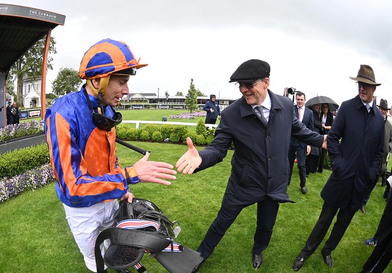 Curragh 25-May-2025 Tattersalls Irish 1000 GuineasA happy Aidan O'Brien greets Ryan Moore after Lake Victoria won for owners Coolmore.Healy Racing