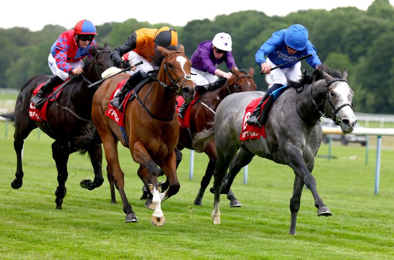 Symbol Of Honour and William Buick blue winning The Betfred Sandy Lane Stakes Haydock 