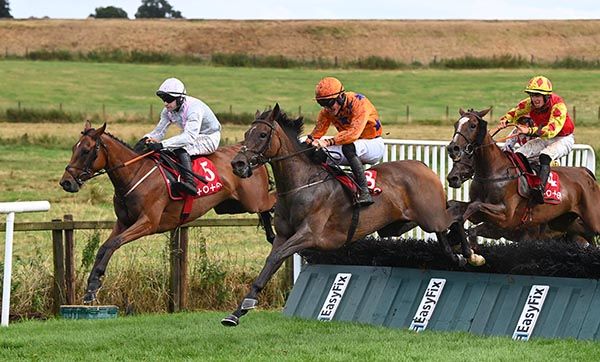 Hurricane Honey, orange, touches down in front over the last