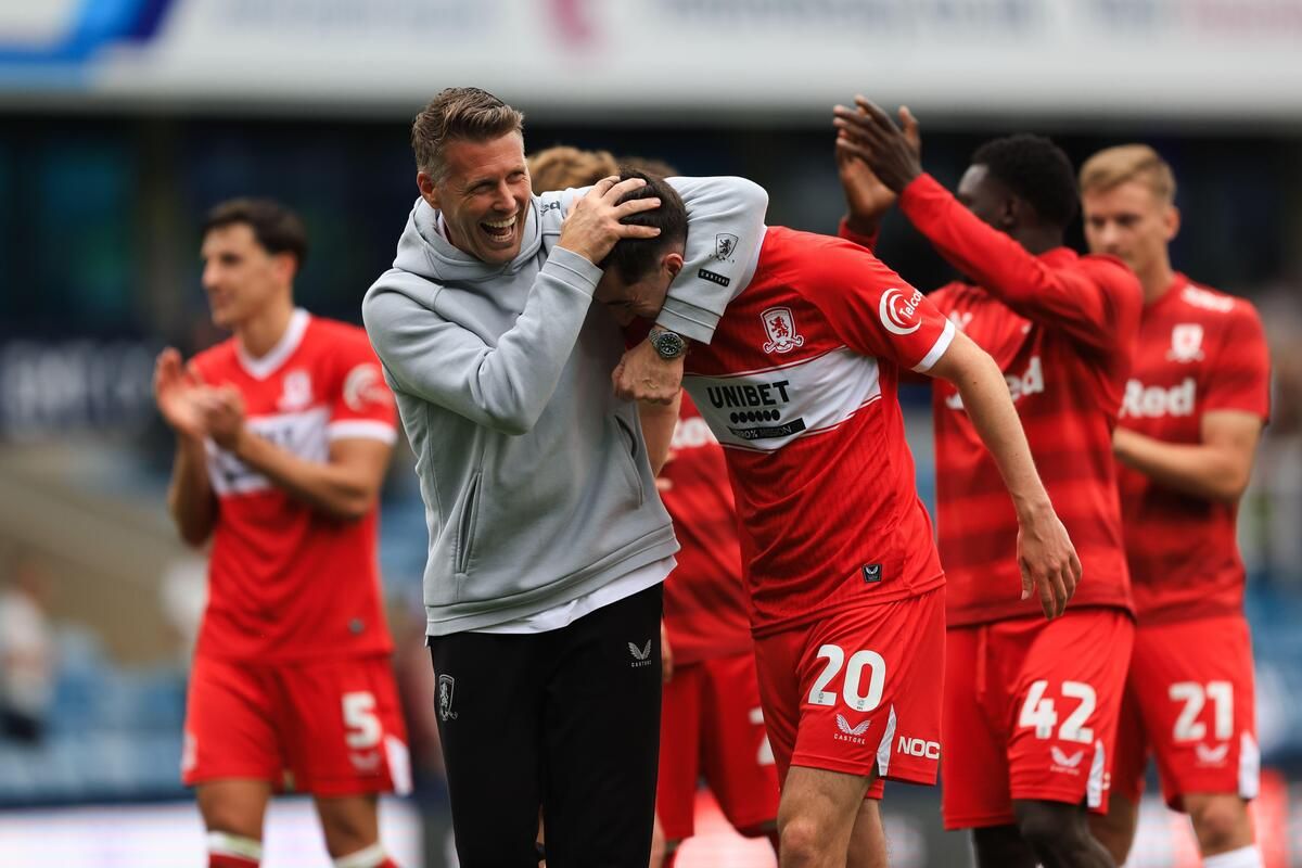 Middlesbrough manager Rob Edwards celebrates with Finn Azaz after his side's 3-0 win at Millwall