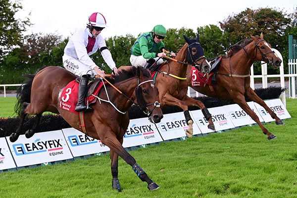 Money Dancer, far side, comes to collar Firebrand on the run-in